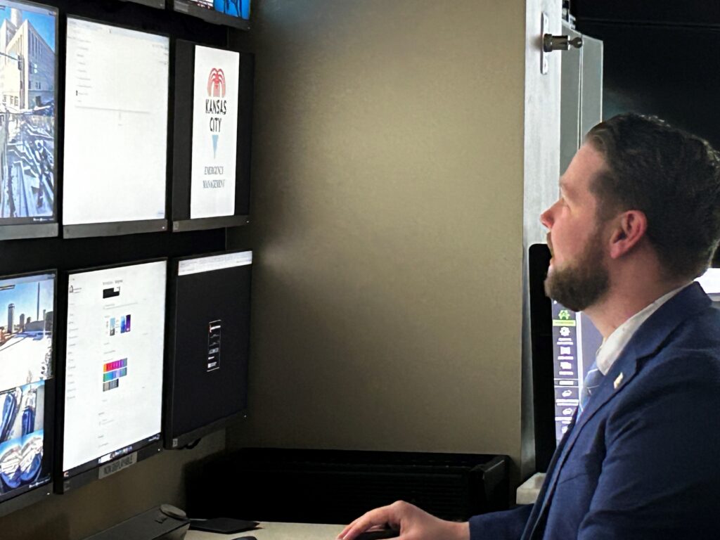 KCPD investigative analyst working at a multi-monitor workstation